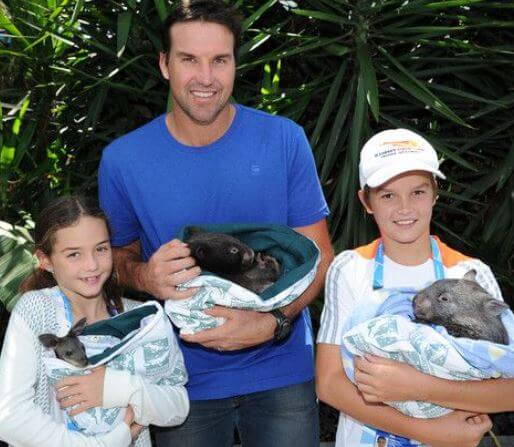 India with her father Pat Rafter and brother.